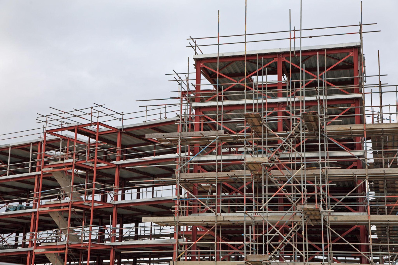 Engineers reviewing blueprints on site